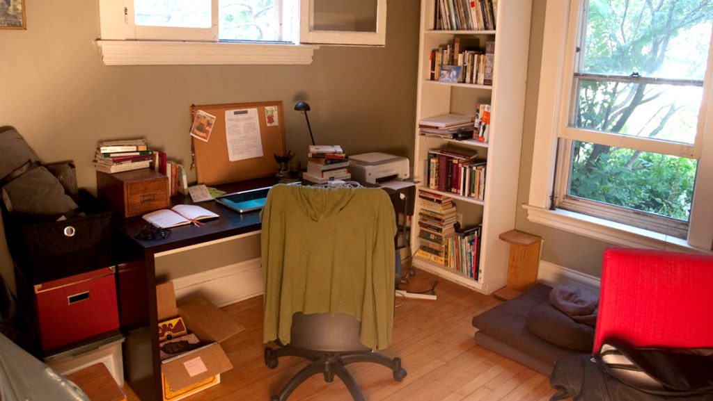A student's study space, desk and bookshelves
